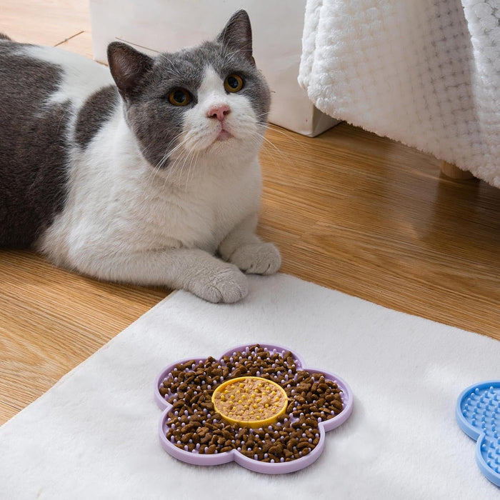 Cat using a filled LickBloom flower lick mat